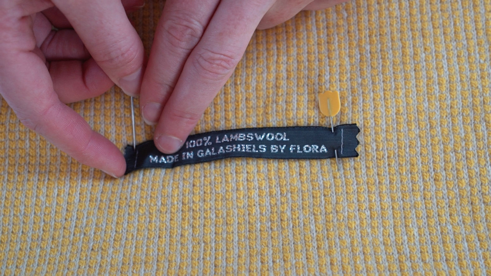 stitching labels to knitwear