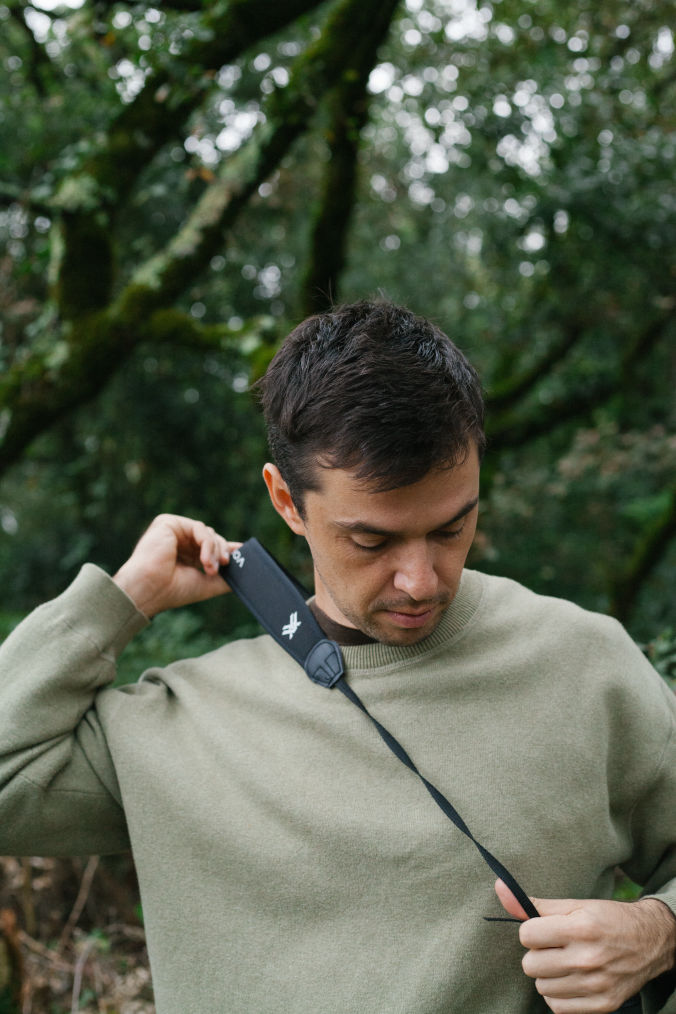 Eugene adjusting his camera strap Videographer Portugal