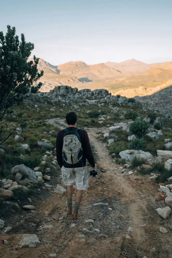 Videographer walking through the Cederberg to film nature