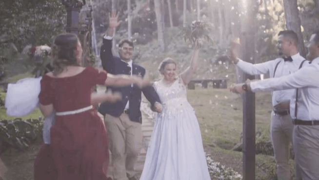 Confetti falling on bride and groom during celebration