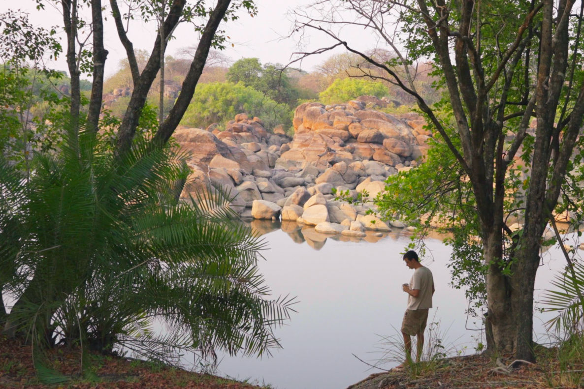 Learn video making while relaxing by the river, capturing natural moments.
