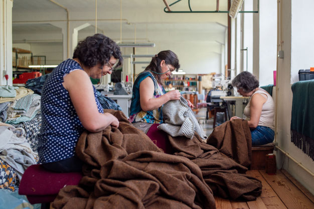 ladies sewing at babuuk textile facotry videographer portugal