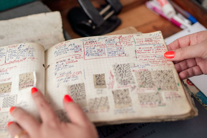 looking at designs in notebook videographer portugal