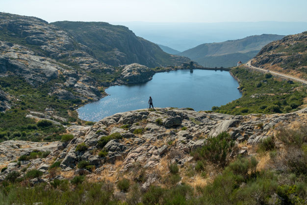 sheep farmer overlooking dam captured by videographer portugal