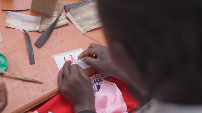 Artisan working on handmade tea label 